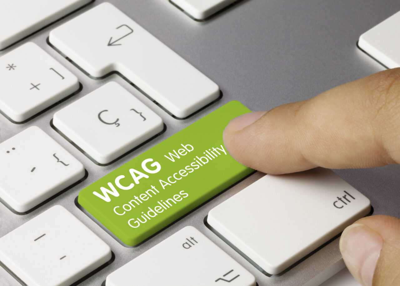 Grüne Taste auf einer Tastatur mit dem Text 'WCAG Web Content Accessibility'